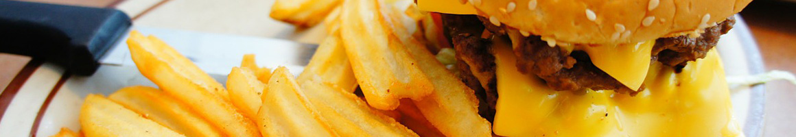 Eating Burger at Stamps Super Burgers restaurant in Jackson, MS.
